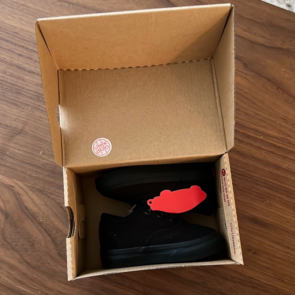 Baby/Toddler All black Vans low size 4. Brand new with tags.